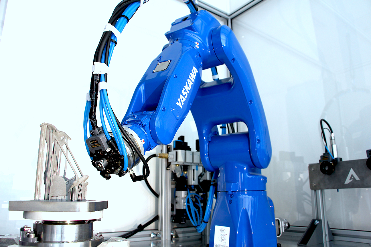 Robot arm with automatic tool-changer approaching an additive manufactured satellite bracket